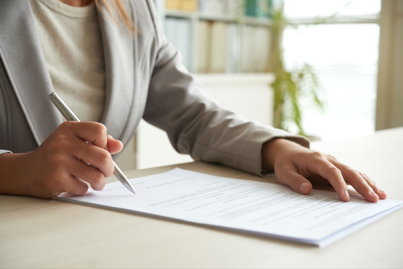 woman signing the document