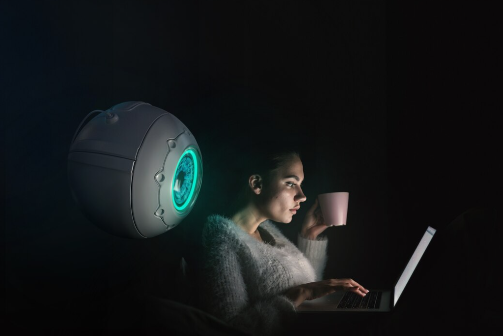 A close-up of a webcam against a blurred blue background