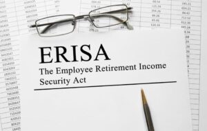 A document titled "ERISA The Employee Retirement Income Security Act" with glasses